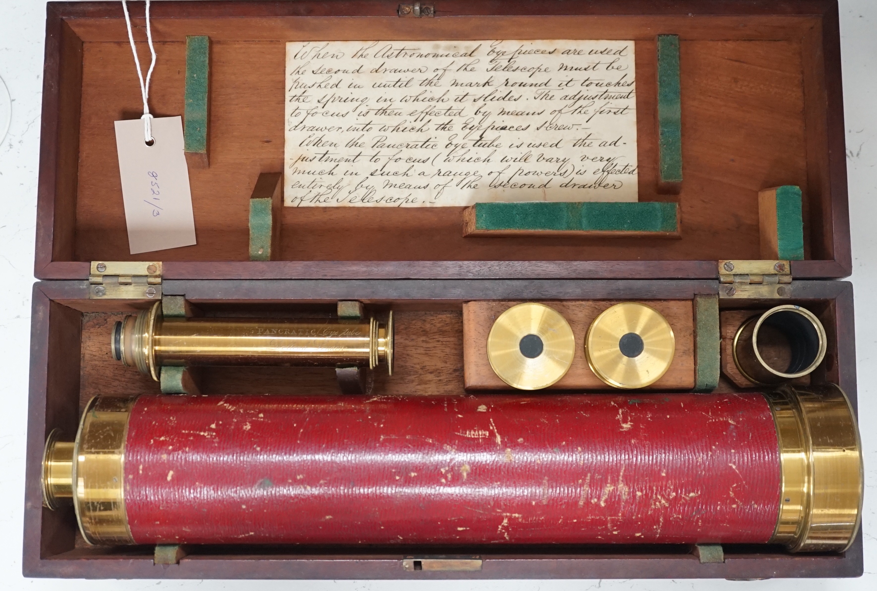 A cased early 19th century brass astronomical telescope, by Dollond, London, with separate screw fitting ‘Pancratic eye tube’ and other optics with sun filters, case 40cm